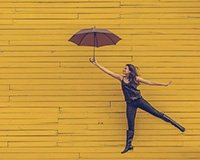 Woman dancing with umbrella